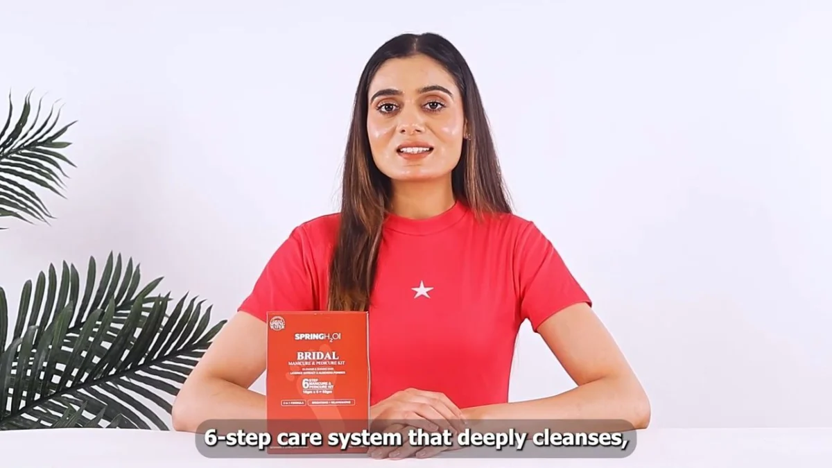 A creator in a filmed cosmetic demonstration showing product use and facial expression