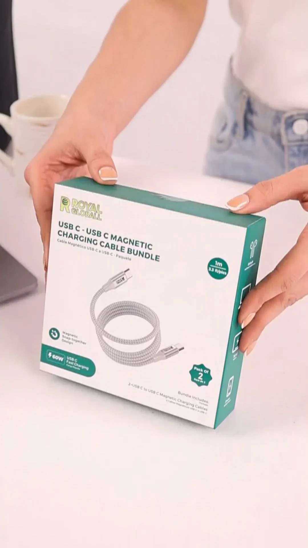 Vertical 9:16 product introduction shot of hands opening a cable bundle box on a white table, framed high enough to stay visible across Reels, Stories and Feed placements